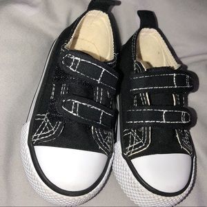 Black & White shoes with velcro straps.